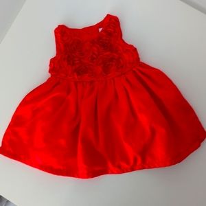 Red dress with flower detail on the bodice. Size newborn